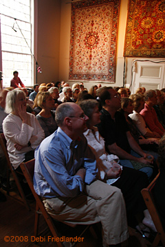 The Church House audience listens attentively